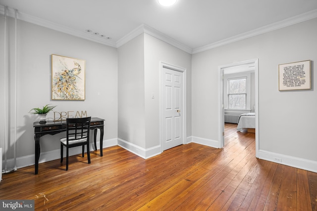 corridor featuring crown molding and wood-type flooring