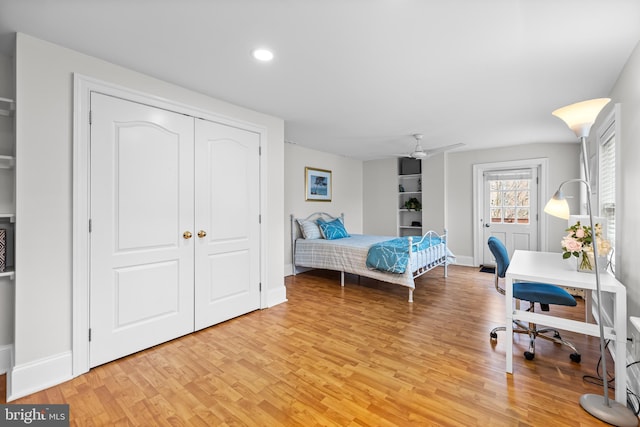 bedroom with a closet and light hardwood / wood-style flooring