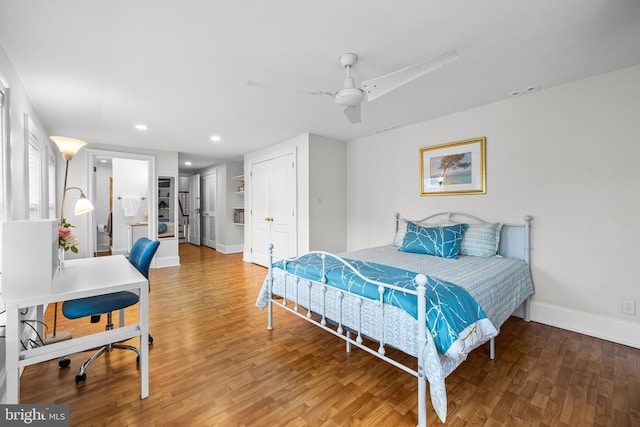 bedroom with hardwood / wood-style flooring and ceiling fan