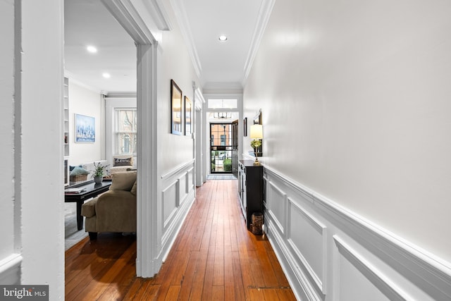 hallway featuring ornamental molding and dark wood-type flooring