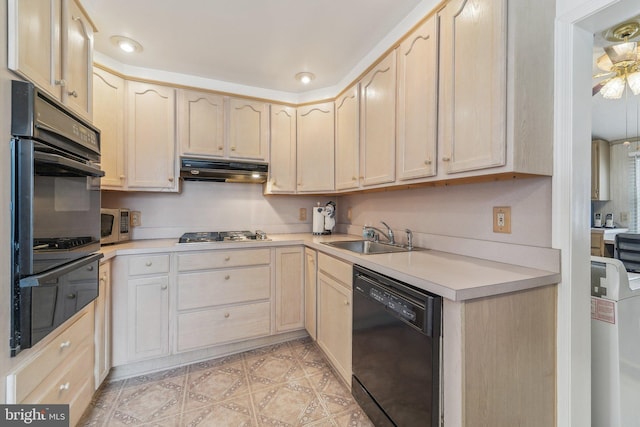 kitchen featuring sink, black appliances, and light brown cabinets