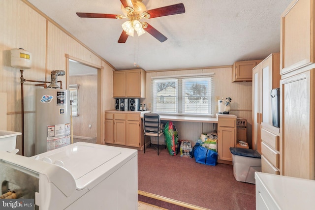 kitchen with carpet flooring, washer / dryer, water heater, and light brown cabinets