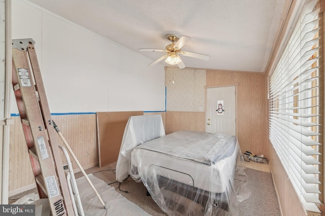 bedroom featuring crown molding and a textured ceiling