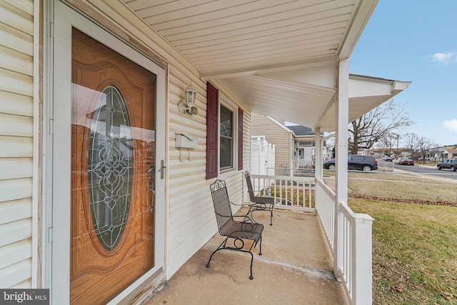 property entrance featuring covered porch