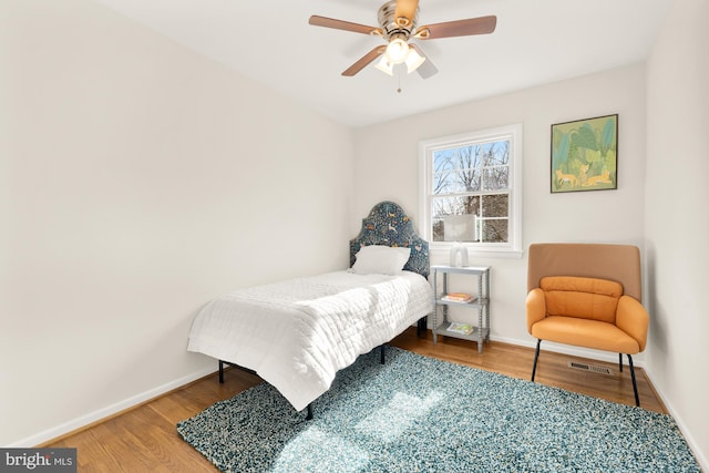 bedroom with wood-type flooring and ceiling fan