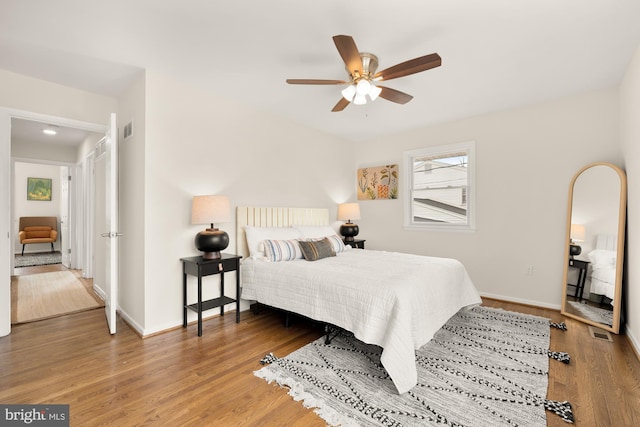 bedroom featuring hardwood / wood-style flooring and ceiling fan