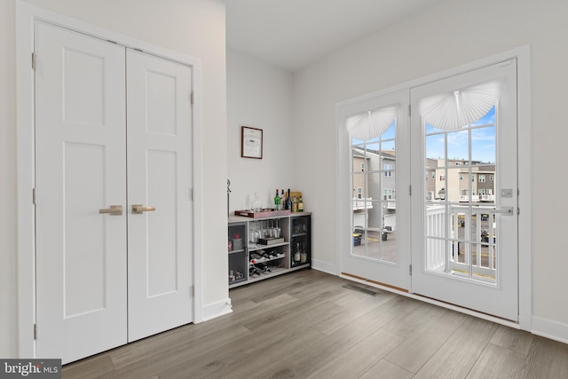 entryway with light hardwood / wood-style flooring