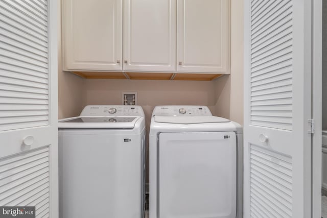 laundry area with cabinets and washer and dryer