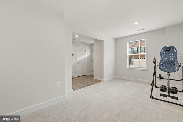 workout room with light carpet