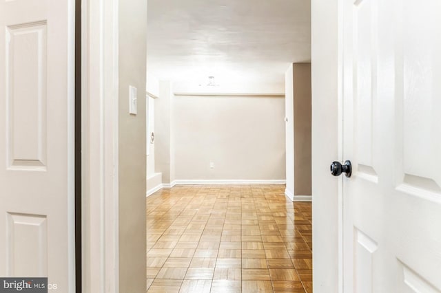 hallway featuring light parquet flooring