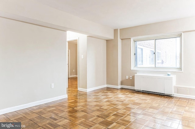 empty room with light parquet floors