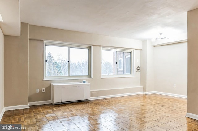 unfurnished room with light parquet floors