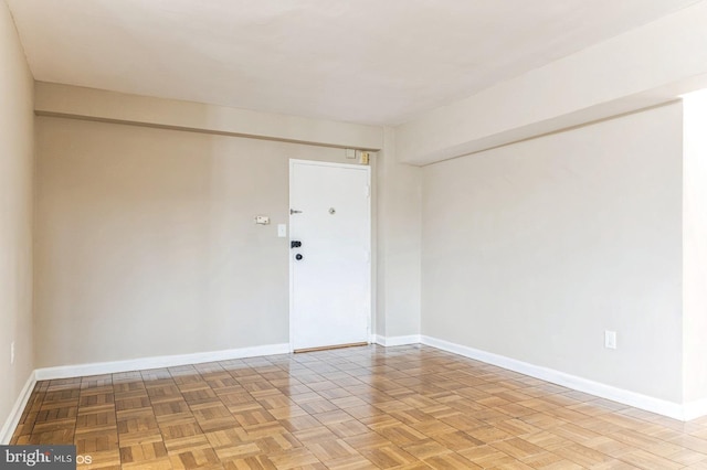 spare room with light parquet flooring