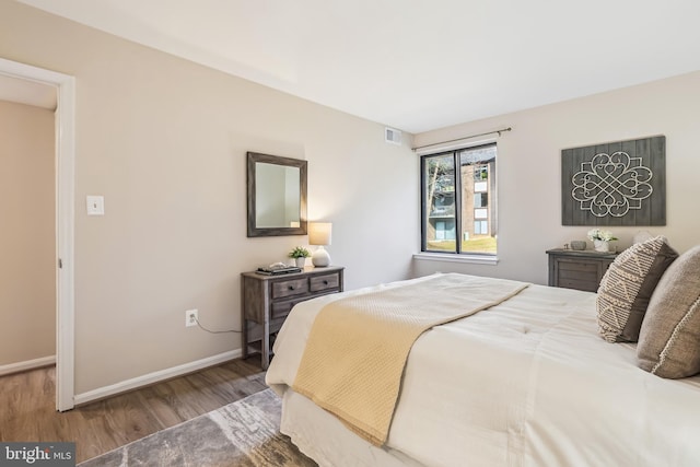 bedroom with hardwood / wood-style floors