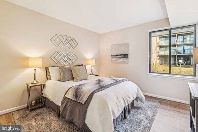 bedroom with light hardwood / wood-style floors