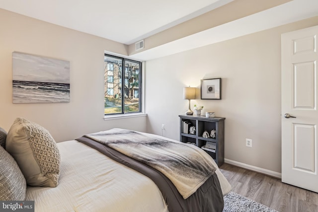 bedroom with light hardwood / wood-style flooring