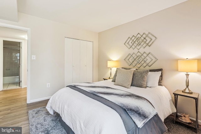 bedroom featuring hardwood / wood-style flooring and a closet