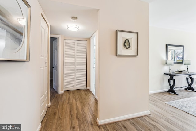 hall with light wood-type flooring