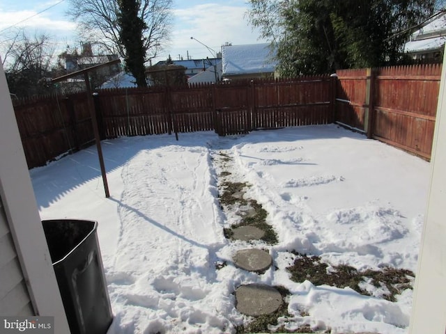 view of yard layered in snow