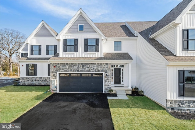 view of front facade featuring a garage and a front lawn