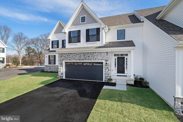 view of front of home with a garage and a front lawn