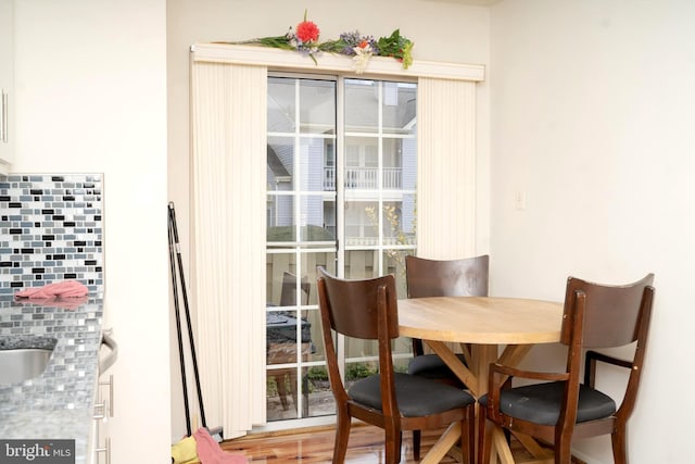 dining space featuring wood-type flooring