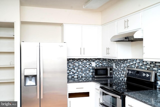 kitchen with backsplash, dark stone counters, white cabinets, and appliances with stainless steel finishes