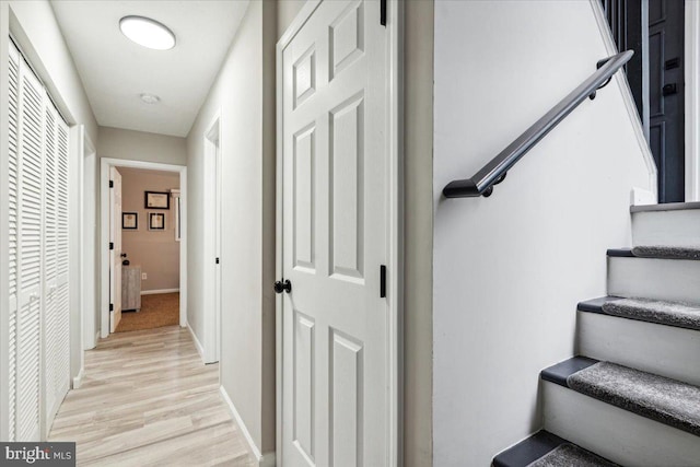 stairway with hardwood / wood-style floors