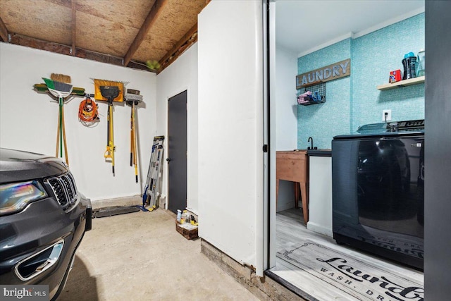 clothes washing area with washer and clothes dryer