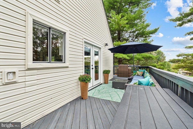 deck featuring french doors and an outdoor hangout area