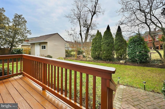 deck with an outbuilding and a lawn