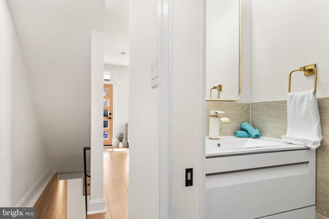 bathroom featuring hardwood / wood-style flooring and vanity