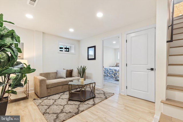 living room with light hardwood / wood-style flooring