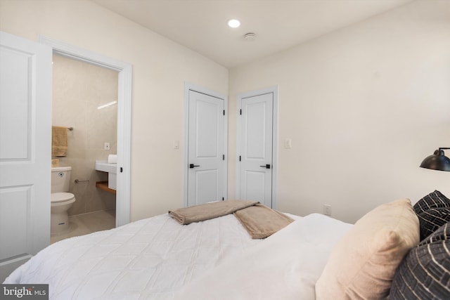 tiled bedroom with ensuite bath