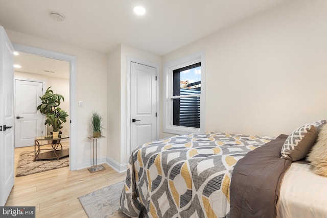 bedroom with light hardwood / wood-style flooring