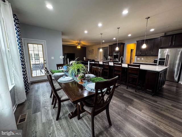 dining area with visible vents, dark wood-type flooring, and recessed lighting