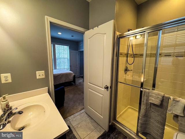 bathroom featuring a shower stall, vanity, connected bathroom, and tile patterned floors