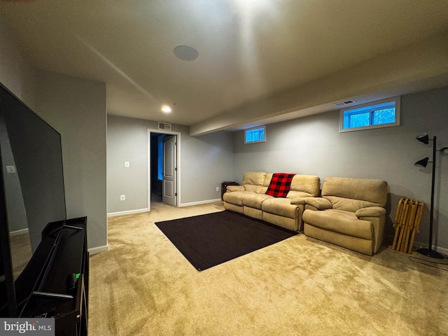 living room with baseboards, visible vents, and carpet flooring