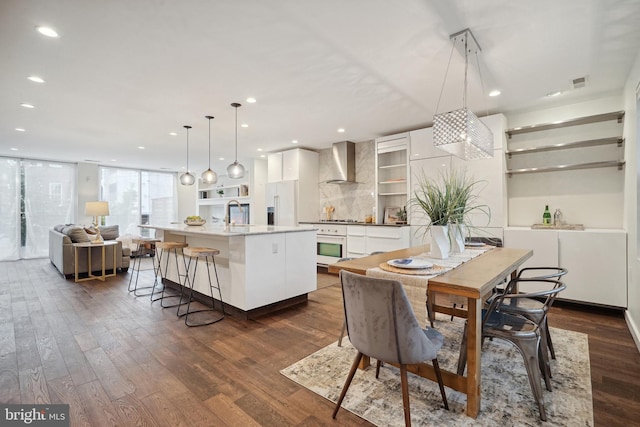 dining space with dark hardwood / wood-style floors