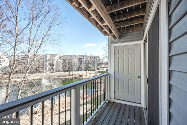 balcony featuring a water view