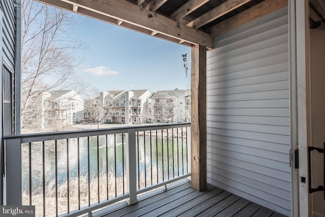 balcony featuring a water view