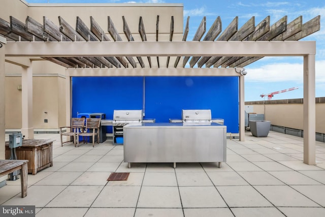 view of patio with an outdoor kitchen and area for grilling