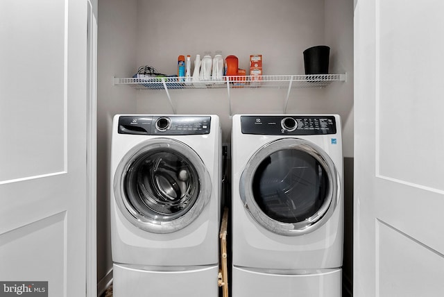 laundry room with laundry area and separate washer and dryer