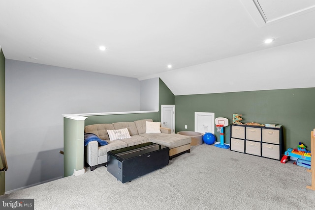 carpeted living area with vaulted ceiling and recessed lighting