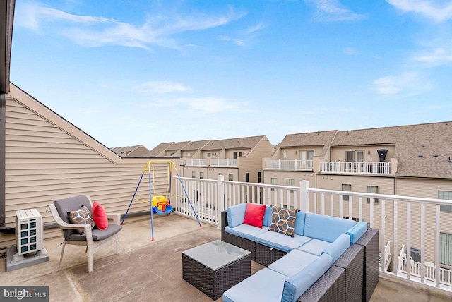 view of patio featuring outdoor lounge area and a residential view