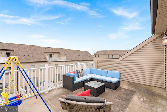 view of patio featuring a playground, a residential view, and an outdoor living space