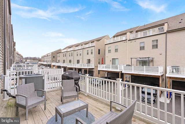 deck featuring a grill and central air condition unit