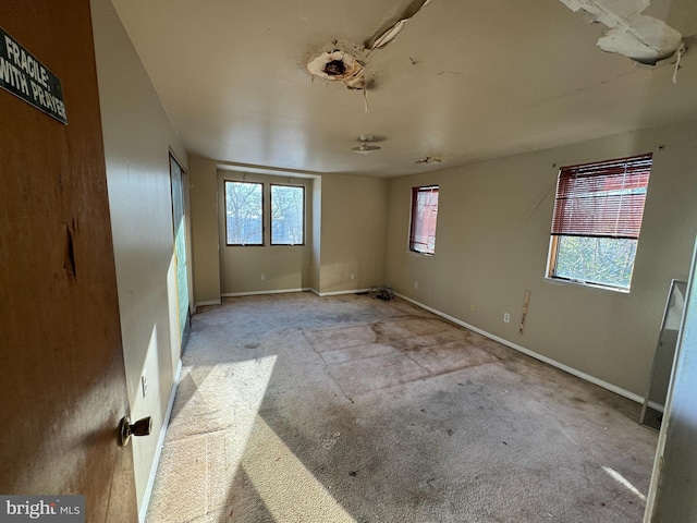 unfurnished room featuring a wealth of natural light