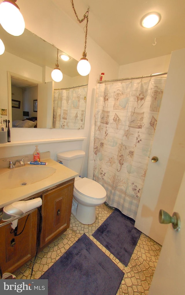 bathroom with vanity and toilet