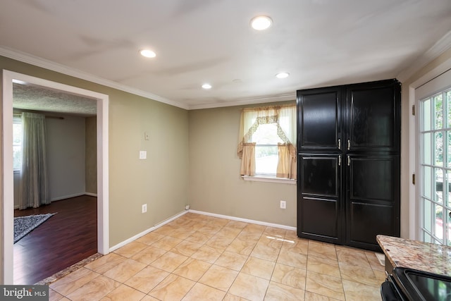 interior space with crown molding and light tile patterned flooring